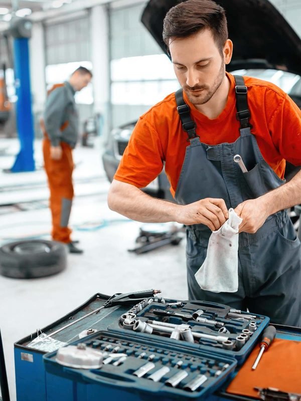 car-mechanic-keeping-tools-polished-B5ZWHYG-min